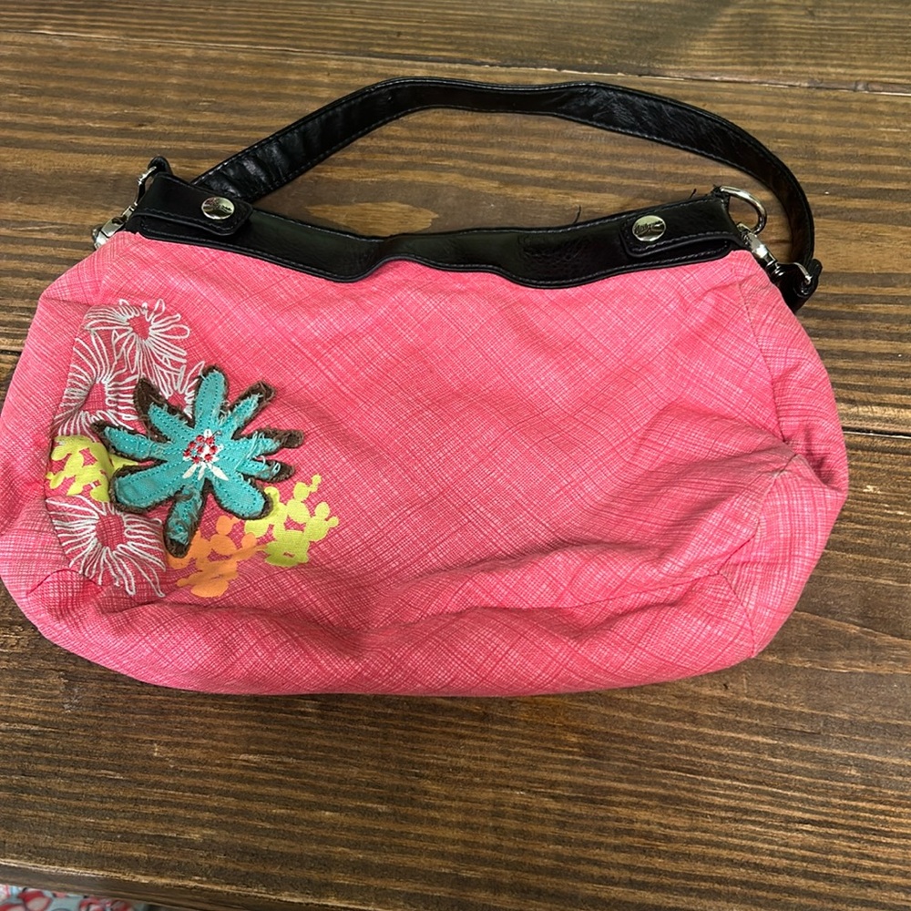 Thirty one purse with three covers.